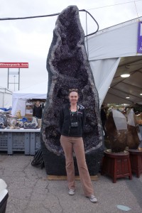 Alisha  beside Giant Amethyst Geode - Tucson Gem and Mineral Show