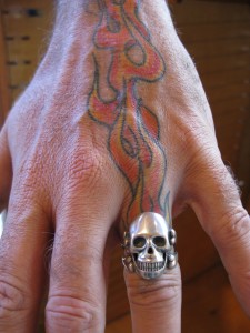 Marty's Skull Ring on Tatooed Hand