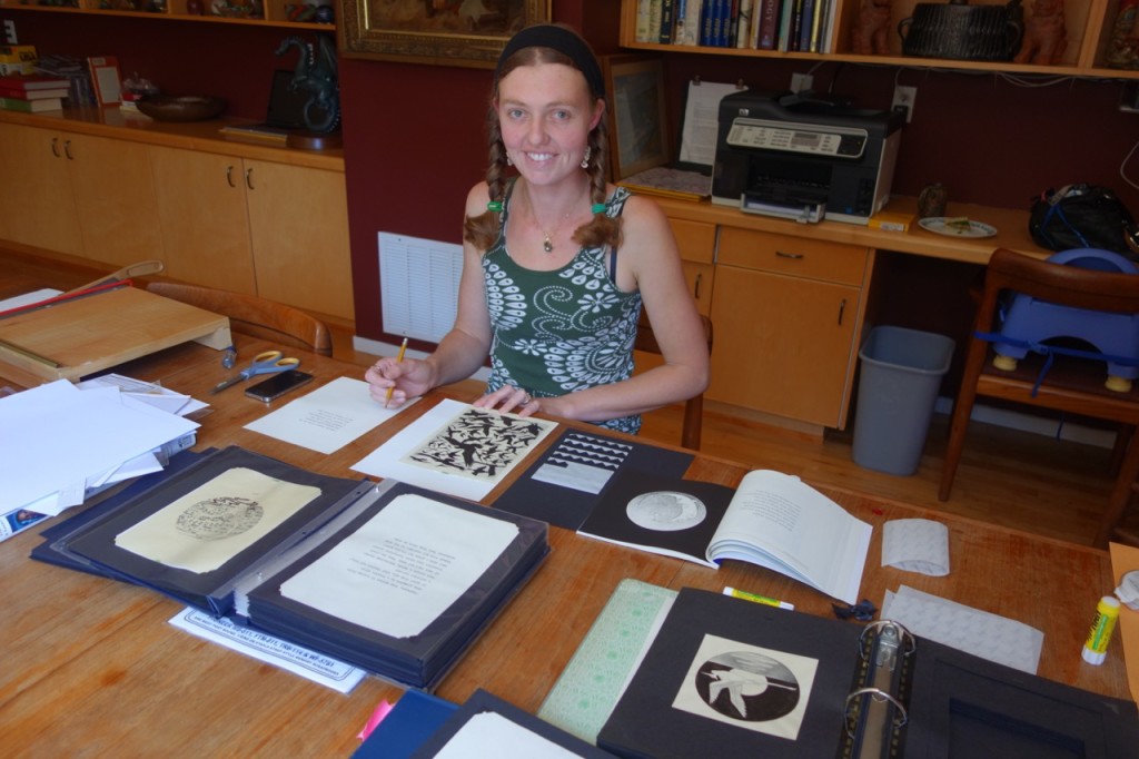 Alisha archiving the original illustrations for Cataclaysmania 