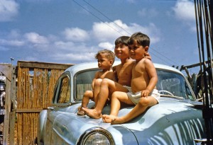 Art and his brothers atop the family car. Okinawa, 1954?