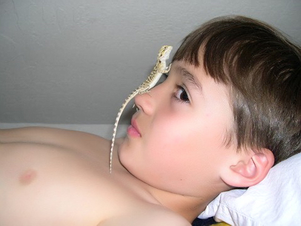 John at ten with Show Off, our first Bearded Dragon.