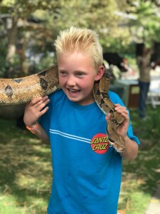 Sterling McCormack, 8 years old, with a Red Tail Boa, Safari West, Santa Rosa 
