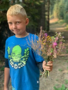 Sterling Jr offering a flower bouquet. 