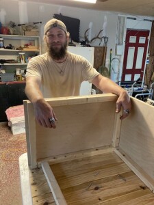 Chad building a storage bench for our ship